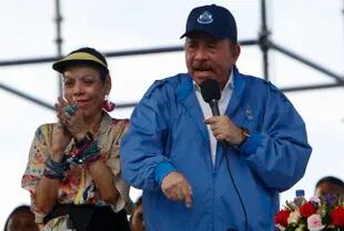 Nicaraguan President Daniel Ortega speaks to his supporters while his wife and Vice President Rosario Murillo pays tribute, in Managua, Nicaragua.  (AP Photo/Alfredo Zuniga)