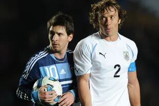 Lionel Messi y Diego Lugano