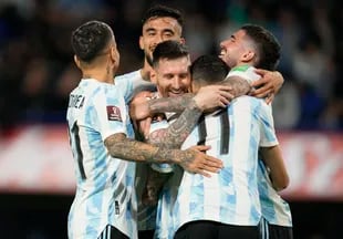 Lionel Messi celebrates with his teammates from the Argentina national team