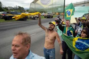 Protesters cut off access to Cuarulhos International Airport in San Pablo.  (AP Photo/Victor R. Caivano)
