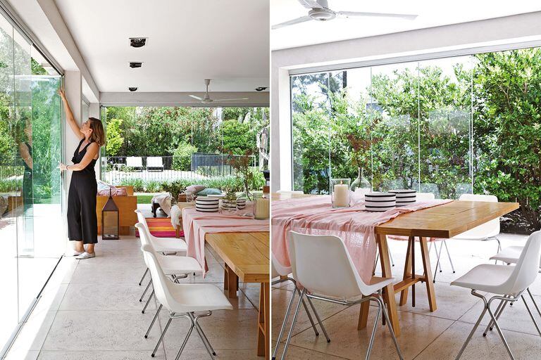 En el sector del comedor, sillas blancas y mesa de madera maciza (Urano Design), con mantel de lino rosa, cuencos a rayas (todo de Blanc Buenos Aires), fanal y florero de vidrio (todo de Arredo).