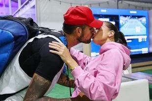 Champion kiss: Kyrgios and Costen