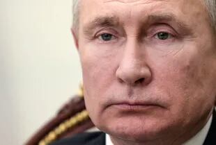 Vladimir Putin, and the Kremlin.  (Photo by Alexei Druzhinin / Sputnik / AFP)