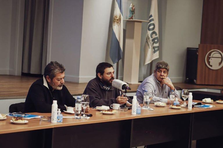 Gerardo Martínez, Juan Grabois y Pablo Moyano dieron el aval para avanzar en un plan de reconversión de planes sociales en trabajo genuino