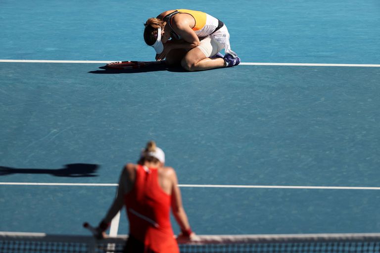 Alizé Cornet, above, collapsed by the emotion of triumph;  Romanian Simona Halep, down, exhausted after falling in the fourth round of the Australian Open.
