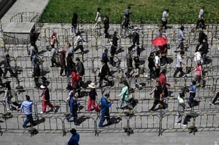 Queues for testing in Beijing.  (Photo by Jade GAO / AFP)