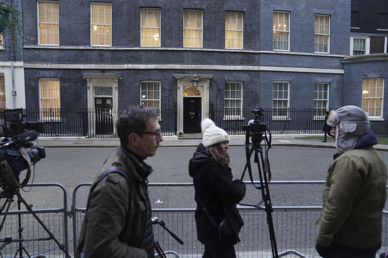 Journalists gather outside 10 Downing Street on Tuesday, January 25, 2022, as British Prime Minister Boris Johnson faces fresh accusations of flouting coronavirus rules after his office acknowledged he celebrated a birthday at the residence. official during the first British quarantine.  (Stefan Rousseau/PA via AP)