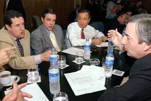 Junto a su mentor, el exsenador Ramón Puerta (Misiones) y los entonces gobernadores Juan Carlos Romero (Salta) y Néstor Kirchner (Santa Cruz)