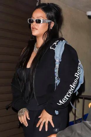 Rihanna, back in the recording studio for the third night in a row in Los Angeles.  The singer looks casual in a black jacket, leggings and a black T-shirt