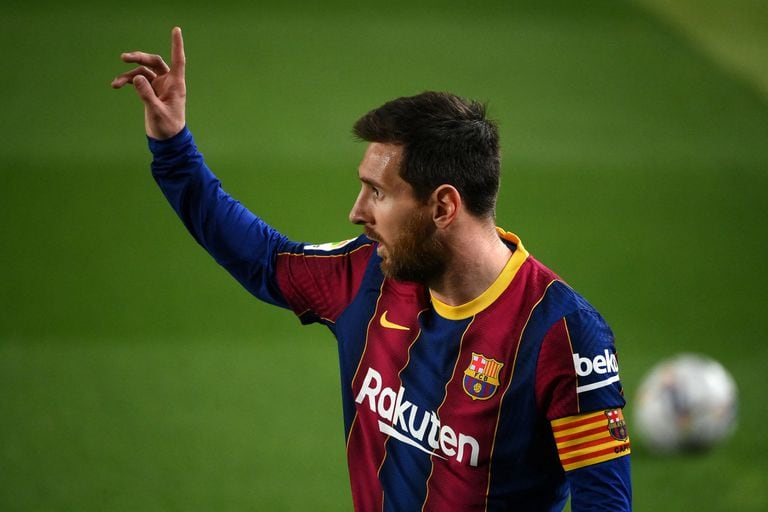 (FILES) In this file photo taken on February 24, 2021 Barcelona's Argentinian forward Lionel Messi gestures during the Spanish league football match between FC Barcelona and Elche CF at the Camp Nou stadium in Barcelona. - Lionel Messi will end his 20-year career with Barcelona after the Argentine superstar failed to reach agreement on a new deal with the club, the Spanish giants announced on August 5, 2021. (Photo by LLUIS GENE / AFP)