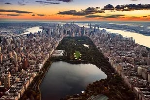 Aerial view of New York City captured from above the Central Park at sunset.