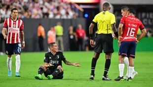 Di Maria Protests From The Floor, Referee Danian Looks At The Parchment