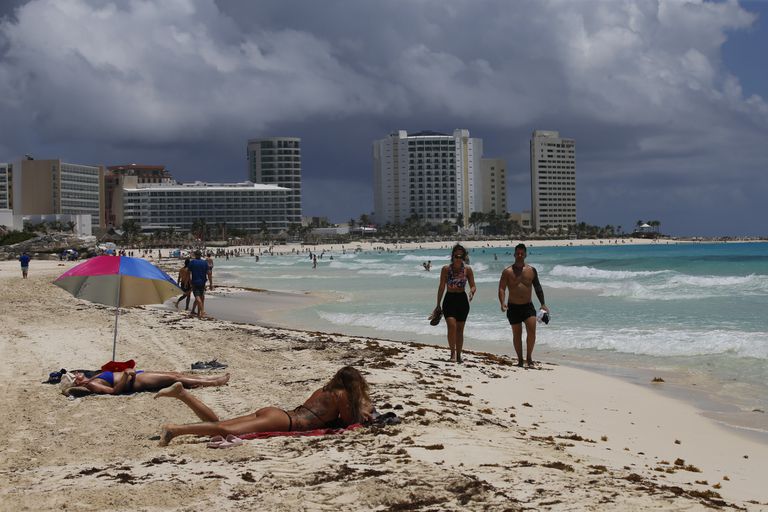 On August 18, 2021, tourists sunbathe on the beach before Hurricane Grace hits Cancn, in the state of Quintana Roo, Mexico.  (AP Photo / Marco Ugarde)