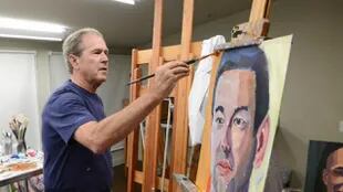 George Bush pinta retratos