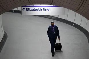 A worker walks through a tunnel at Liverpool Street station during a test run of a Transport for London (TfL) Elizabeth Line train between Paddington station and Liverpool Street station, in London May 11, 2019. 2022. 