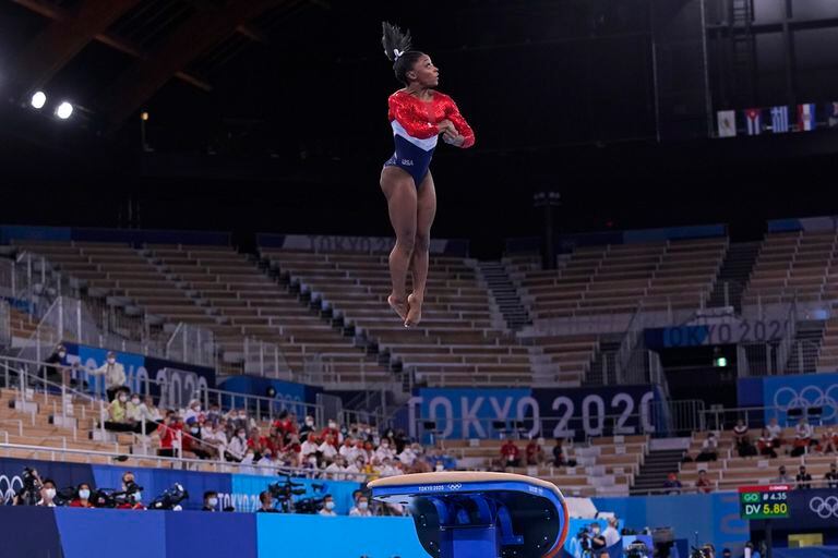 Simone Biles, of the United States, performs on the vault during the artistic gymnastics women's final at the 2020 Summer Olympics, Tuesday, July 27, 2021, in Tokyo. (AP Photo/Gregory Bull)