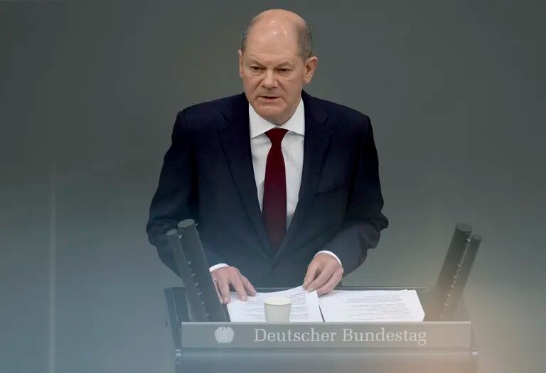 German Chancellor Olaf Scholz delivers a speech on the Russian invasion of Ukraine during a meeting of the federal parliament at the Reichstag building, Sunday, February 27, 2022, in Berlin. 