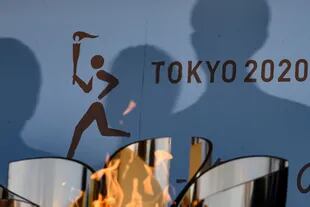 La llama olímpica permanecerá en la capital japonesa, en una inusualmente extensa estadía.