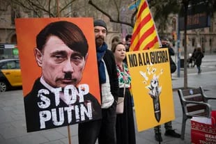 At the start of the war, many opponents compared Putin to Hitler.  (Photo by Joseph Lago/AFP)