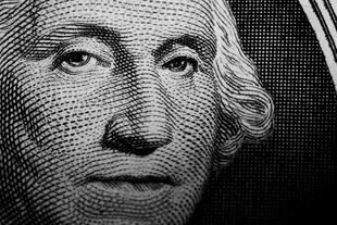 Close up detail of George Washington's portrait on the US One Dollar Note.
