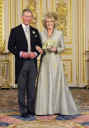 (EMBARGOED TILL  0001 BST MONDAY 11 APRIL 2005) WINDSOR, ENGLAND - APRIL 9: TRH Prince Charles, The Prince of Wales and The Duchess Of Cornwall, Camilla Parker-Bowles pose in the White Drawing Room at Windsor Castle for the Official Wedding photograph following their marriage on April 9, 2005 in Windsor, England. (Photo by Hugo Burnand/Pool/Tim Graham Picture Library/Getty Images)