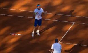 Mayer y el desahogo tras un momento histórico en la Copa Davis, luego de vencer al brasileño Souza en un match de casi siete horas; Orsanic, por entonces capitán, lo acompaña.