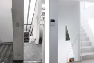 Escalera con piso de microcemento, baranda continua de caño redondo y ventanas de aluminio anodizado en color natural.