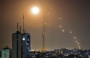 A rocket launched from Gaza city controlled by the Palestinian Hamas movement, is intercepted by Israel's Iron Dome aerial defence system, on May 11, 2021. (Photo by MAHMUD HAMS / AFP)