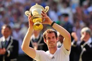 The dream moment: Murray with the Wimbledon trophy to end 77 years without British triumphs