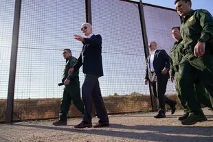 President Joe Biden walks along a stretch of the US-Mexico border in El Paso, Texas, on Jan. 8, 2023. (AP Photo/Andrew Harnik, File)