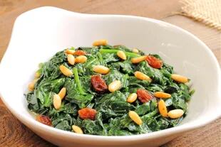 Mediterranean spinach with raisins, pine nuts and anchovy sauce.