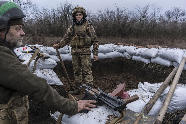 Ukrainian soldiers build a bunker on the front line on December 12, 2021 in Zolote, Ukraine.  A buildup of Russian troops along the border with Ukraine has raised concerns that Russia intends to invade the Donbas region, most of which is held by separatists after a 7-year war with the Ukrainian government.  On Tuesday, US President Joe Biden met with Russian President Vladimir Putin via video conference to discuss escalating tensions.