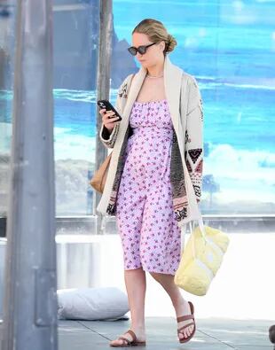 Jennifer Lawrence looks at the cell phone, after spending a few hours in a spa