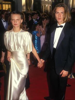 River y la actriz Martha Plimpton, su entonces pareja, en los Oscars de 1989 en los que el actor estaba nominado por el film Running on Empty