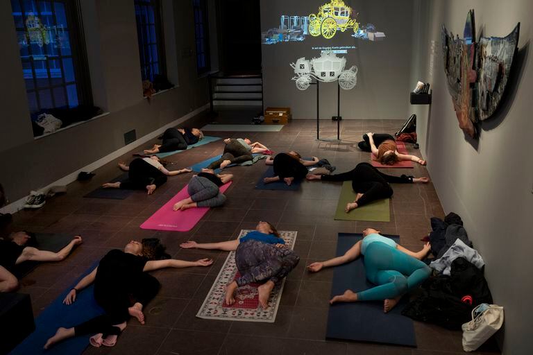 People take a yoga class at the Museum in Amsterdam today that Dutch museums, theaters and concert halls played host to businesses that are allowed to open to customers as a protest against their own omicron-imposed closures