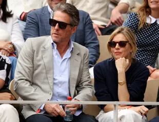 Actors Hugh Grant and Sienna Miller are seen in the stands during the men's singles final match between Rafael Nadal of Spain and Casper Ruud of Norway on day 15 of the French Open 2022 at Roland Garros on June 5, 2022 in Paris, France.  (Photo by Adam Pretty/Getty Images)