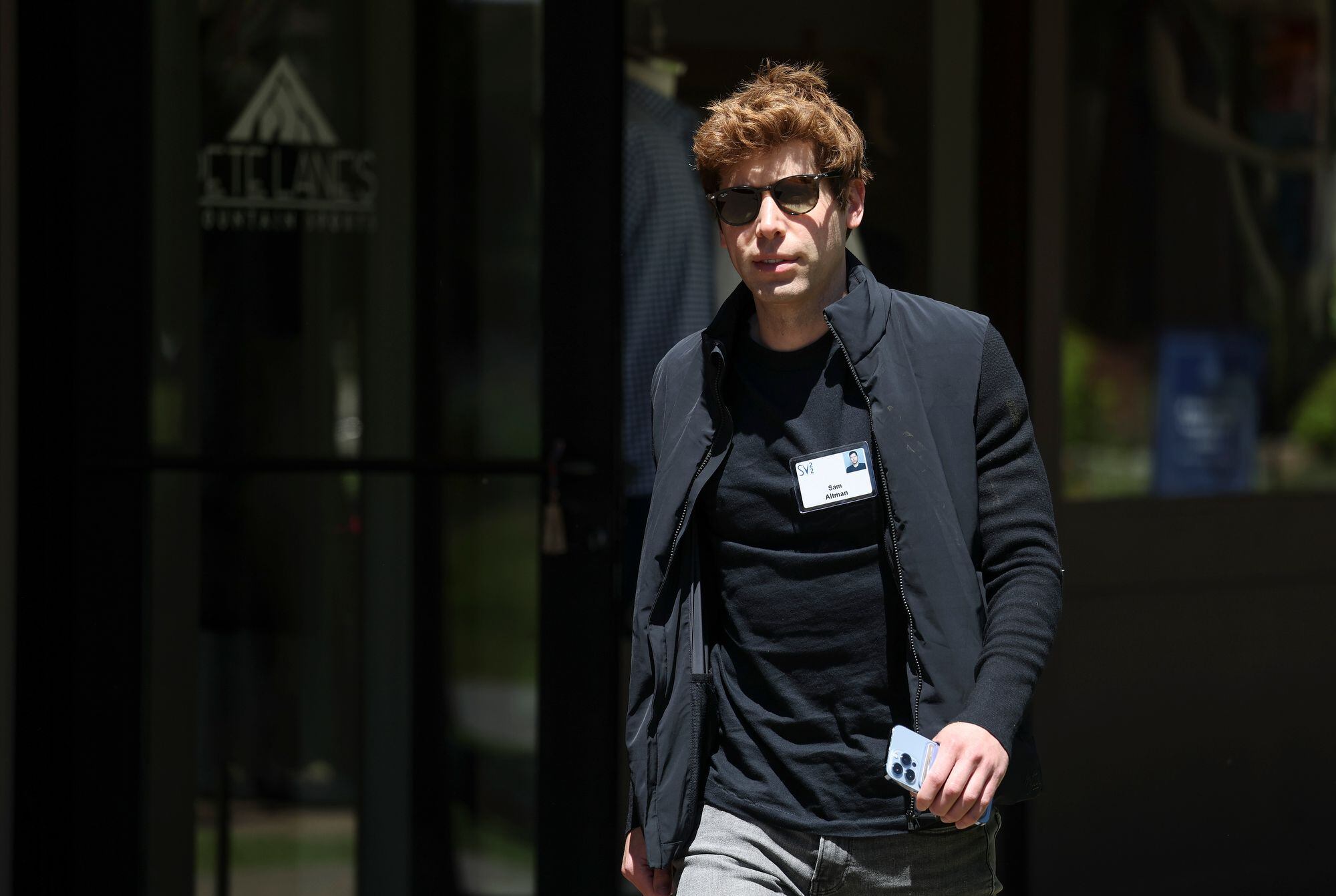 SUN VALLEY, IDAHO - JULY 06: Sam Altman, CEO of OpenAI, walks from lunch during the Allen & Company Sun Valley Conference on July 06, 2022 in Sun Valley, Idaho. The world's most wealthy and powerful businesspeople from the media, finance, and technology will converge at the Sun Valley Resort this week for the exclusive conference. (Photo by Kevin Dietsch/Getty Images)