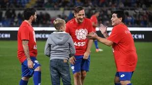 Diego, con su hijo, y Totti, con el suyo