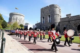 Members of the military march into St George's Chapel at Windsor Castle in Windsor ahead of the funeral of Britain's Prince Philip, Duke of Edinburgh.