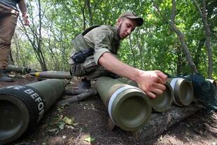 A Ukrainian soldier prepares ammunition in the Kharkiv region of northeastern Ukraine. 