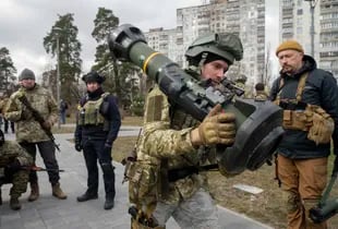 A member of the Ukrainian Regional Defense Forces holds an NLAW anti-tank weapon outside Kyiv, Ukraine, Wednesday, March 9, 2022.