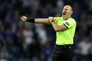 Referee Antonio Mateu Lahoz gestures during the Champions League final soccer match between Manchester City and Chelsea at the Dragao Stadium in Porto, Portugal