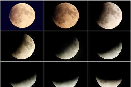 Una combinación de imágenes muestra a la luna cuando entra en un eclipse lunar parcial en Berlín, Alemania