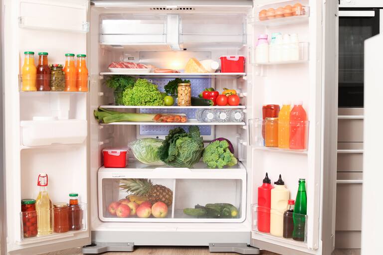 Open,Refrigerator,Filled,With,Different,Food,In,Kitchen
