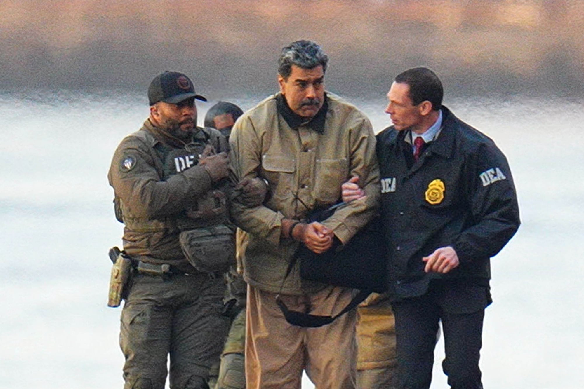 NEW YORK, NY - JANUARY 5: Nicolas Maduro is seen in handcuffs after landing at a Manhattan helipad, escorted by heavily armed Federal agents as they make their way into an armored car en route to a Federal courthouse in Manhattan on January 5, 2026 in New York City. (Photo by XNY/Star Max/GC Images)