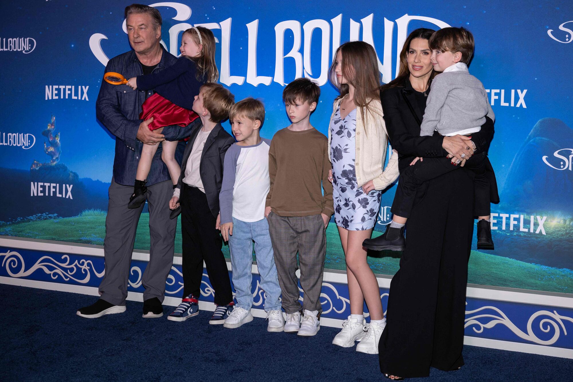 US actor Alec Baldwin (L), Hilaria Baldwin (R) and family arrive for the New York premiere of Netflix's animated film