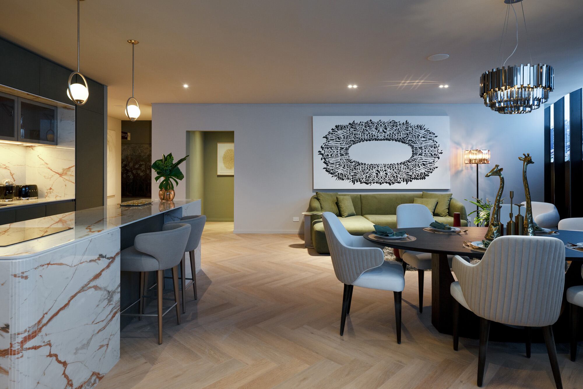 Una unidad modelo con cocina, comedor y living integrados
