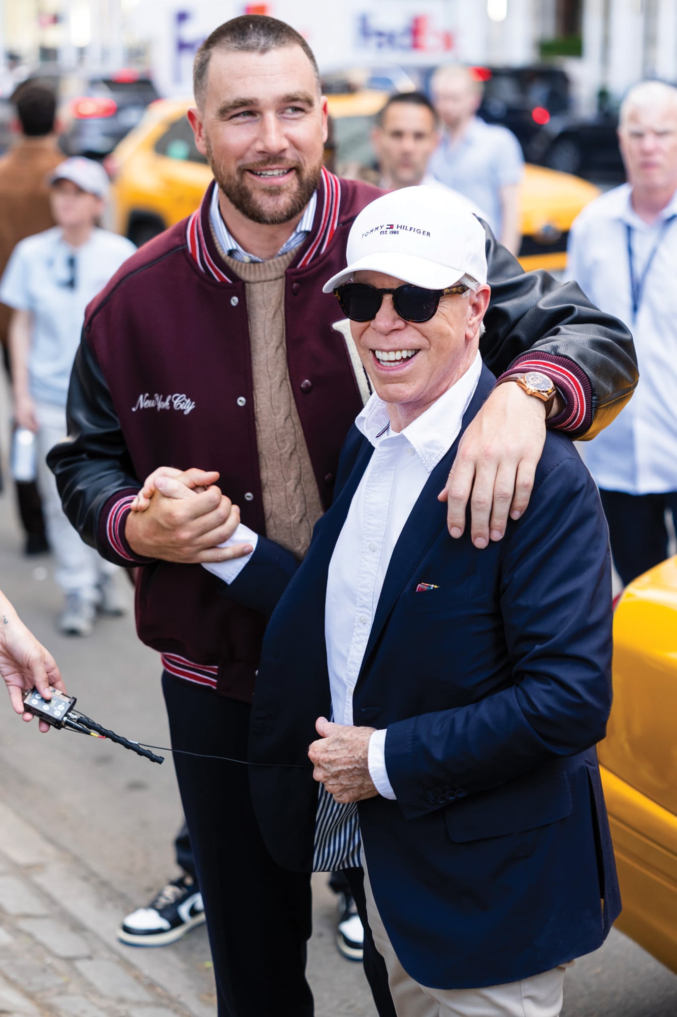 Junto a
Tommy Hilfiger en un
alto del shooting