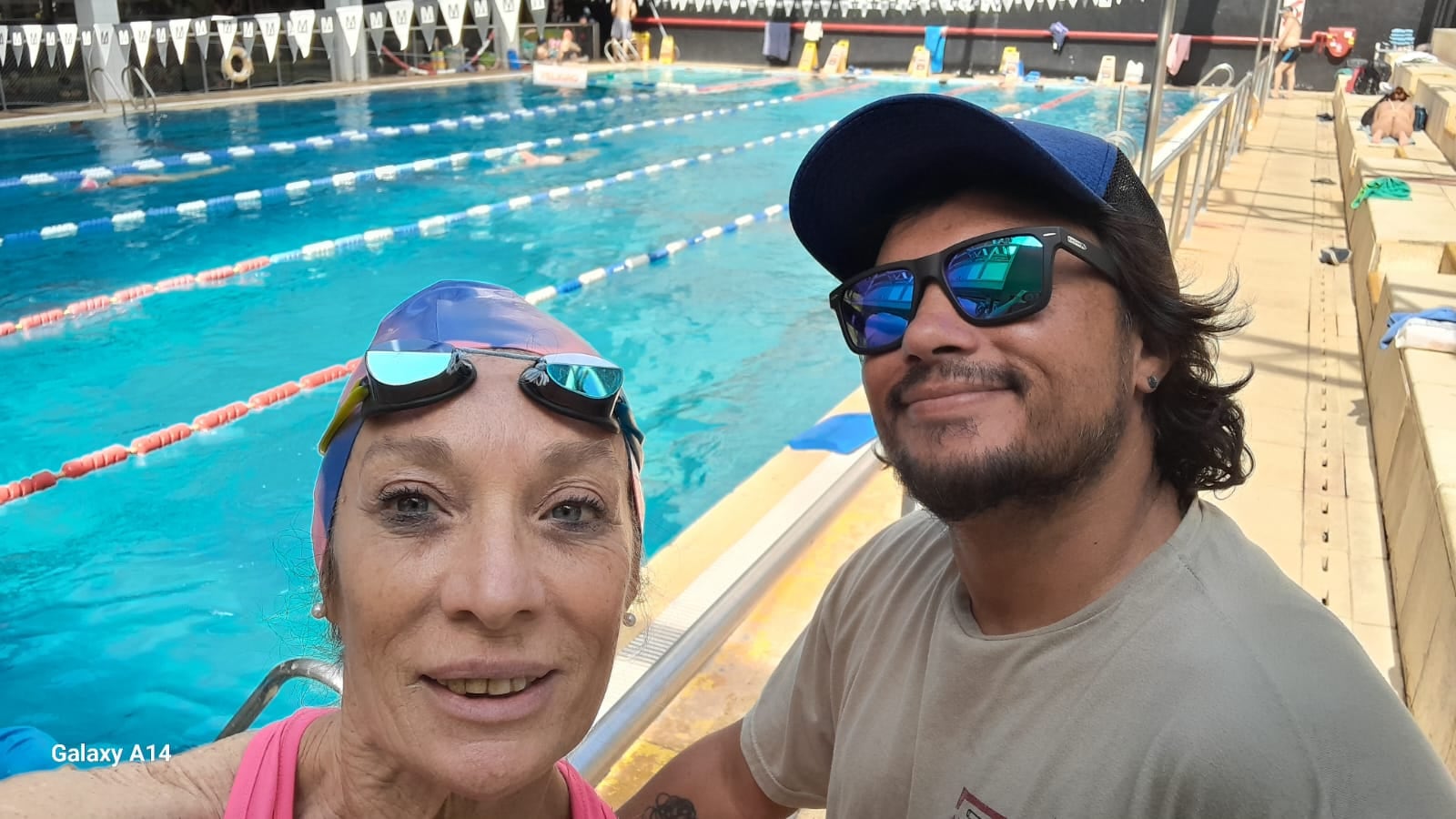Con su profesor de Natación, Gerardo