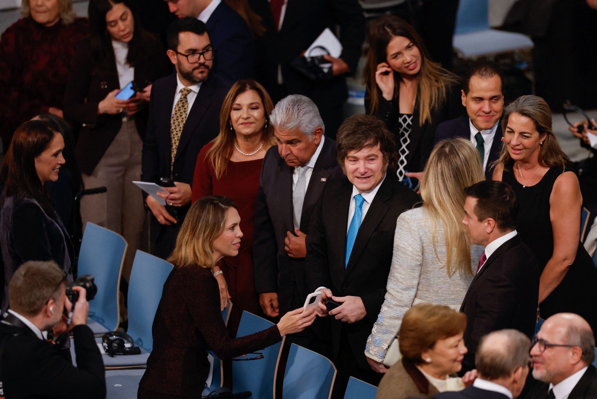 Panama's President Jose Raul Mulino (2ndL) and his wife Maricel Cohen de Mulino (L) and Argentina's President Javier Milei (3rdL) greet family members of Nobel Peace Prize 2025 laureate Venezuelan opposition leader Maria Corina Machado (not in picture) as Venezuelan activist Magalli Meda (R) looks on before the Nobel Peace Prize 2025 award ceremony on December 10, 2025 in Oslo, Norway. The 2025 Nobel Peace Prize was awarded to Machado for her efforts to bring democracy to Venezuela, challenging the iron-fisted rule of Venezuelan President Nicolas Maduro, who has been president since 2013. (Photo by Odd ANDERSEN / AFP)